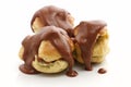 Three profiteroles over white