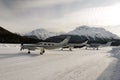 Three propeller type private jet and planes in the snow covered airport in the alps switzerland in winter