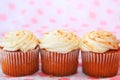 Three pumpkin spice cupcakes