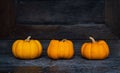 Three pumpkins on the background Royalty Free Stock Photo