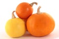 Three pumpkins isolated on a white background with a drop shadow Royalty Free Stock Photo