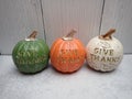 Giving thanks, green, orange, white pumpkins (Halloween Thanksgiving decorations) Royalty Free Stock Photo