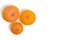 Three pumpkins white background, top view. Royalty Free Stock Photo