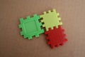 Three puzzle pieces in red, yellow, and green Royalty Free Stock Photo