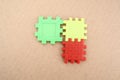 Three puzzle pieces in red, yellow, and green Royalty Free Stock Photo