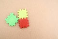 Three puzzle pieces in red, yellow, and green Royalty Free Stock Photo