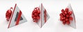 Three pyramidal white gift box with red ribbon
