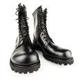 three quarter front view on pair of black leather 10-inch new black military combat boots, isolated on white background Royalty Free Stock Photo