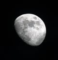 Three quarter moon in great detail in a black night sky Royalty Free Stock Photo