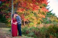 Pregnant couple kissing outdoors in autumn Royalty Free Stock Photo