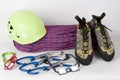 Three quick draws, belay device, climbing footwear, dynamic rope, climbing helmet and belay glasses Royalty Free Stock Photo