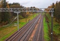 Three railway tracks in autumn time.