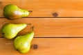 Three raw green pears on table wooden table Royalty Free Stock Photo