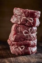 Three raw medallions of thick juicy fillet steak