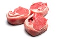 Three raw uncooked lamb loin chops on a white background, isolated, Meat industry product Royalty Free Stock Photo