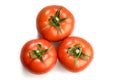 Three realistic looking tomatoes lying in a triangle isolated in white background