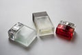 Three rectangular perfume bottles on white background Royalty Free Stock Photo