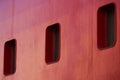 Three Rectangular Portholes On A Red Ship Hull Royalty Free Stock Photo