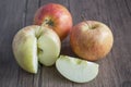 Three red apple on wooden background