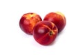 Three red bald peaches on white background. Peaches closeup red color