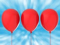 Three red balloons