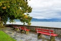 Three Red Benches Facing Beautiful Bodensee Lake On Rainy Autumn Day In Lindau, Germany