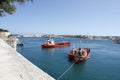 Three red boats in Valletta harbour, Malta