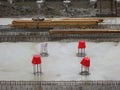 Three red buckets on a construction site in Amsterdam Royalty Free Stock Photo