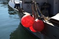 Three red buoys on a boat Royalty Free Stock Photo