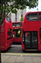 Three red buses in London