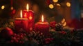 Three red candles light up a festive Christmas tree scene Royalty Free Stock Photo