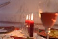 Three red candles lit at a romantic dinner Royalty Free Stock Photo