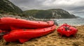 Three red canoes on the beach
