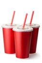 Three red cardboard cups with a straws