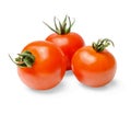 Three red cherry tomatoes with green spikes on a white isolated background. Close-up. Royalty Free Stock Photo