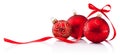 Three red Christmas baubles with ribbon bow isolated on white background Royalty Free Stock Photo