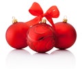 Three Red decorations Christmas ball with ribbon bow Isolated Royalty Free Stock Photo