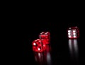 Three red dice on old wood black table with space for text