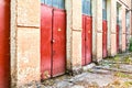 Three red doors bearing a danger label