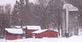 Barns and silos in winter snowstorm Royalty Free Stock Photo