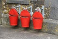Three red fire buckets Royalty Free Stock Photo