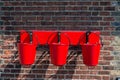 Three red fire buckets wall mounted Royalty Free Stock Photo