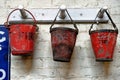 Three red fire buckets in an workshop in Beamish Village Royalty Free Stock Photo