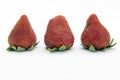 Three red fresh strawberries close up Royalty Free Stock Photo