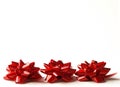 Three red gift bows