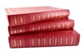 Three red golden decorated laying books