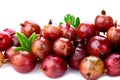 Three red gooseberry with green leaf isolated on white background. Clipping Path. Full depth of field..