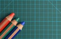 RGB red, green, blue colored pencils on a cutting mat Royalty Free Stock Photo