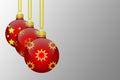 Three red hanging christmas tree balls with snowflakes and stars ornaments on a grey background Royalty Free Stock Photo