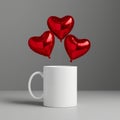 Three red heart shaped balloons floating above a white mug on a gray surface in a studio setting Royalty Free Stock Photo